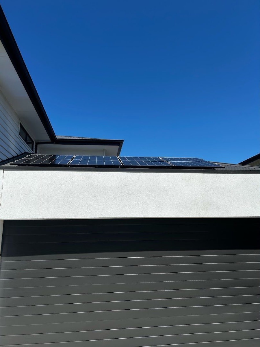 Solar panels on a modern roof against a clear sky